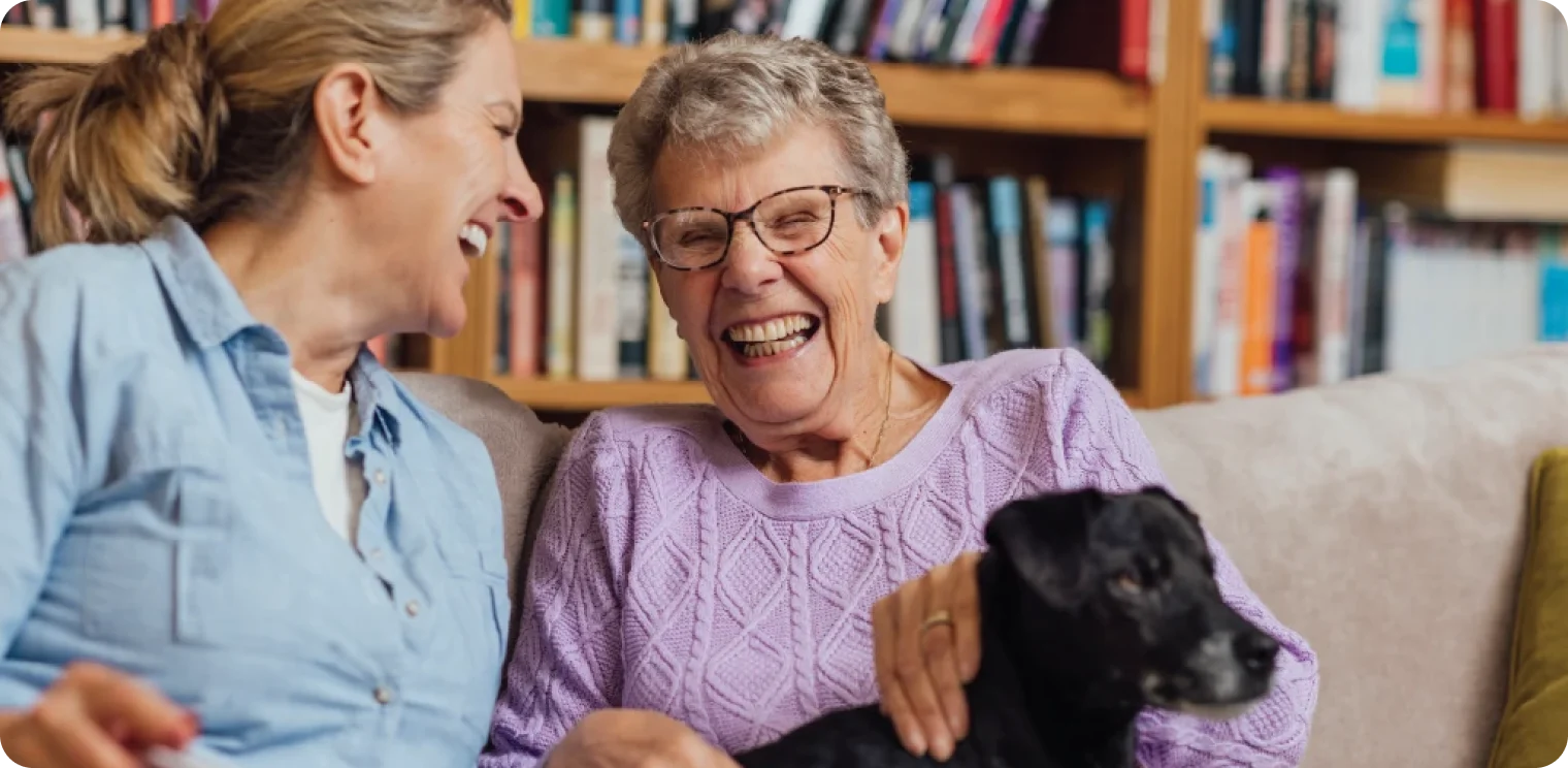Two Women With Their Dog [header]