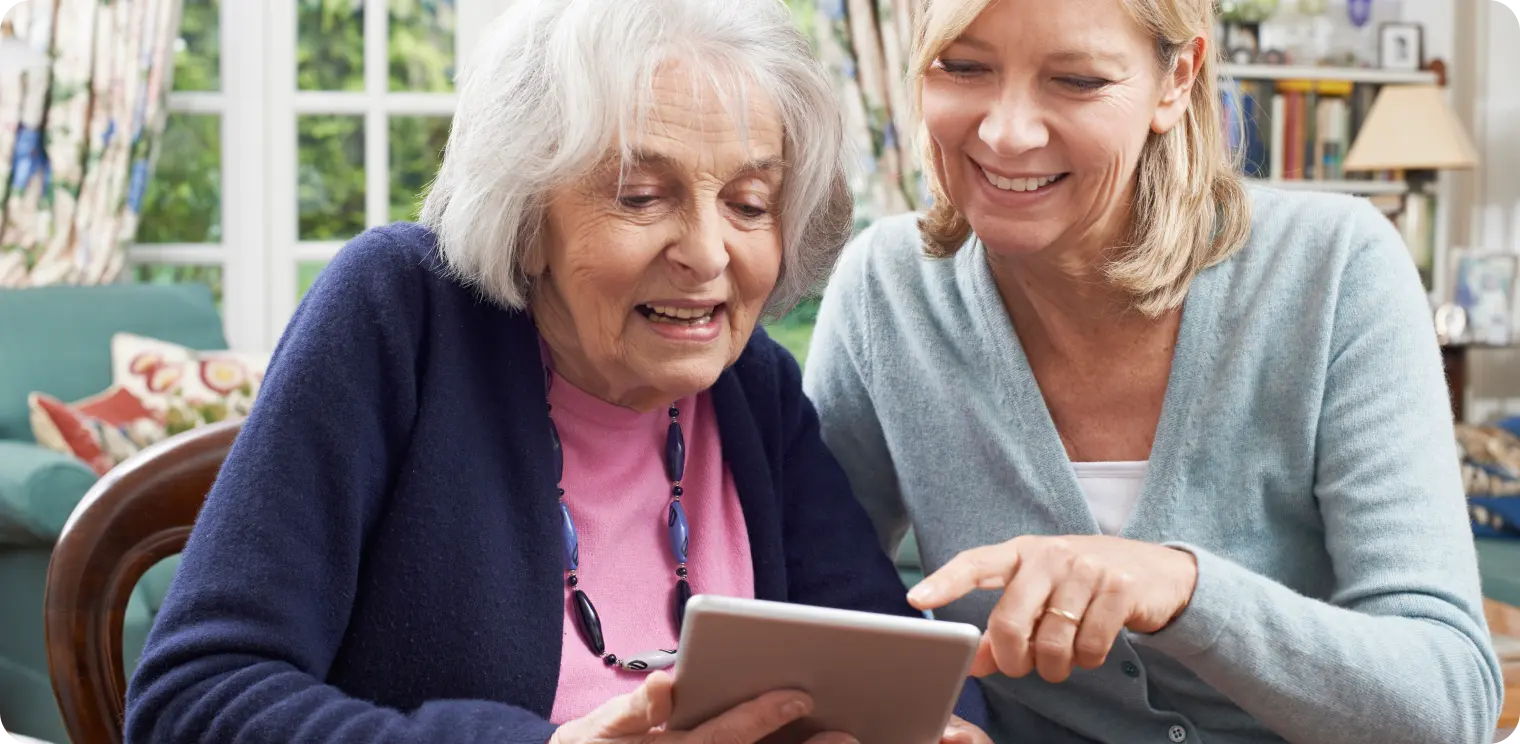 Elderly Woman With Carer on Phone [header]