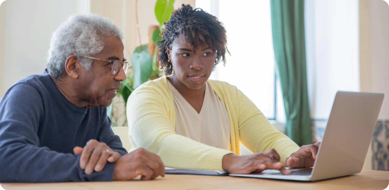 Elderly Man With Carer on Laptop [header]