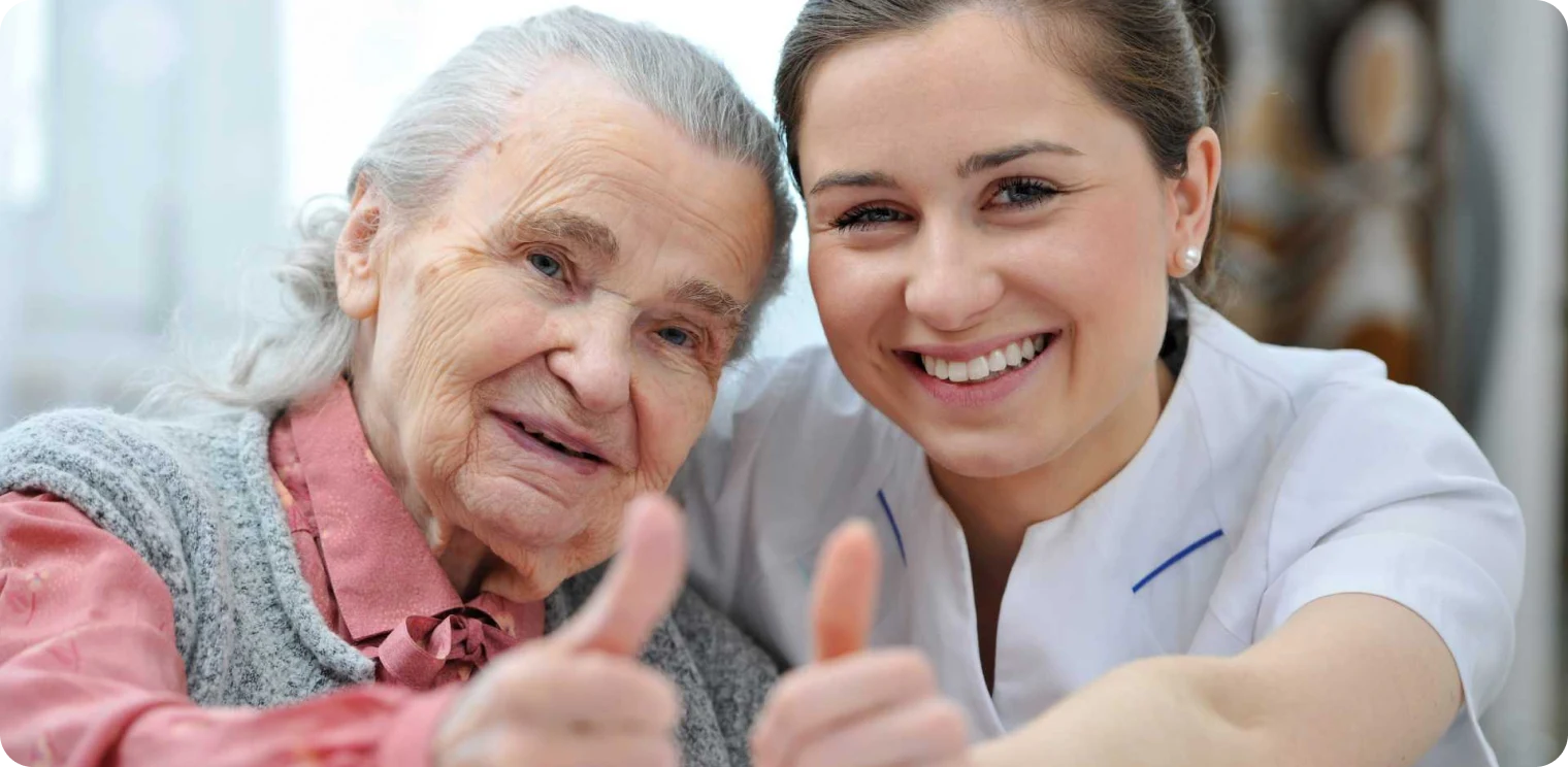 Elderly Woman and Carer Thumbs up [header]