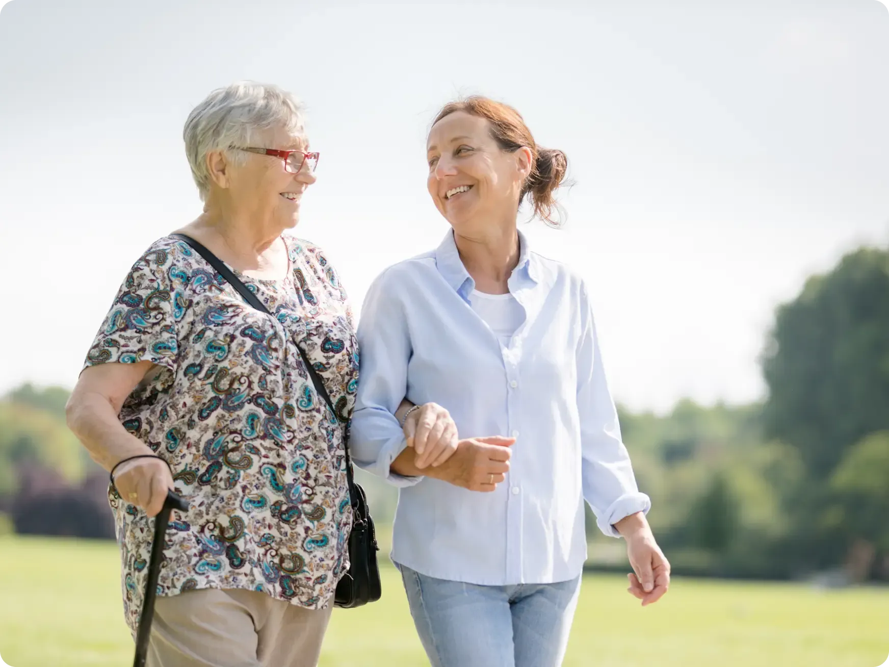 Elderly Woman and Carer Walking [content]